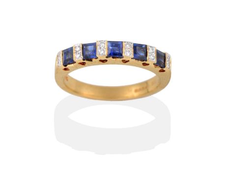 An 18 Carat Gold Sapphire and Diamond Half Hoop Ring, square step cut sapphires alternate with pairs of diamonds, to a yellow