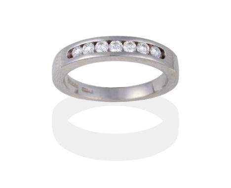 An 18 Carat White Gold Diamond Half Hoop Ring, the round brilliant cut diamonds channel set within a plain polished band, tot
