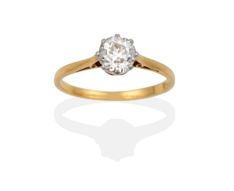 A Diamond Solitaire Ring, the round brilliant cut diamond in white claw setting, to pointed shoulders on a plain polished sha