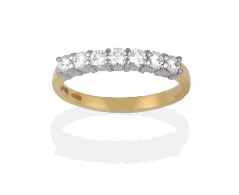 An 18 Carat Gold Diamond Half Hoop Ring, round brilliant cut diamonds in white claws on a yellow plain polished shank, total 