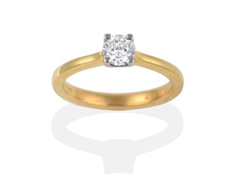 An 18 Carat Gold Diamond Solitaire Ring, a round brilliant cut diamond in a claw setting, to knife edge shoulders, estimated 