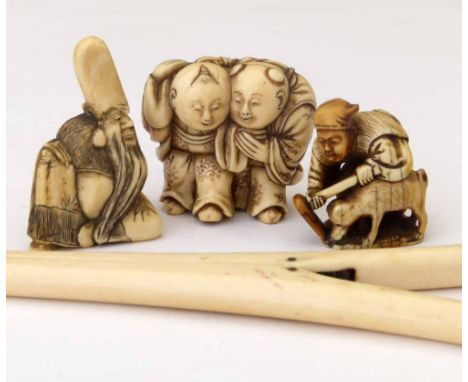 Japanese carved ivory netsuke of Fukurokoju; a small okimono of a farmer and dog; an ivory netsuke of embracing twins, signed