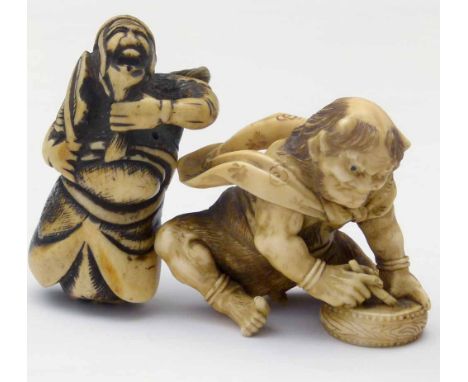 Japanese carved ivory figure of an oni with a drum and brush, height 5cm; also a bone netsuke carved as a sage holding a leaf