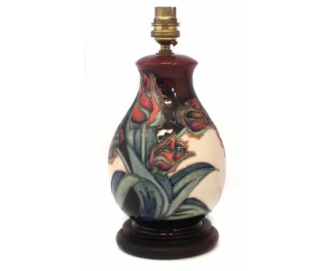Moorcroft lamp base, decorated with red tulips pattern, 20cm high excluding fittings,     Condition report: No damage or rest