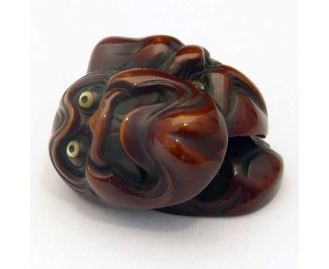 Japanese red ivory netsuke carved as three kijin-kei Noh masks with shell eyes, signed, Meiji period, 3.5cm. Condition report