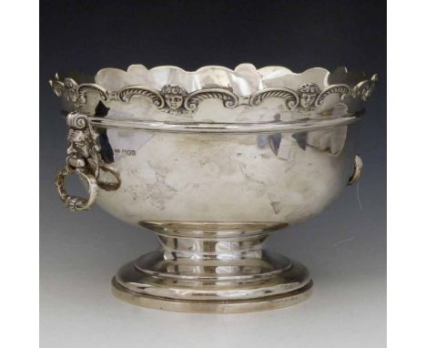 Silver punch bowl, with mask capped side handles on a waisted stem and spreading foot, Elkington, London 1900, diameter 30cm,