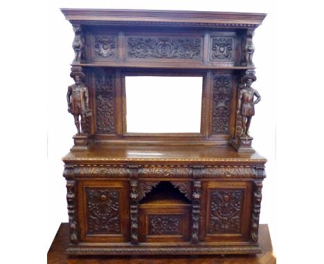 Mid 19th century continental carved and stained oak side cabinet, top section with shelf above rectangular bevelled mirror, f