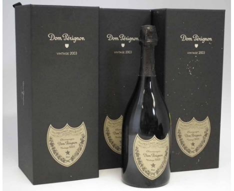 Three Dom Perignon Vintage 2003 Champagne, in card cases two card cases have unbroken seals. (3) Condition report: The seals 