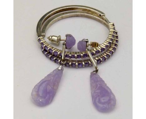 Pair of pendent purple jade earrings set in white metal, length 42mm; also a pair of 925 hoop earrings with purple stones.