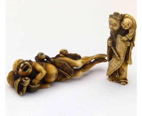 Japanese carved ivory group of a prone opium smoker with an imp and monkey, length 8cm; an ivory netsuke depicting a calligra