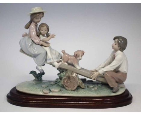 Lladro 'See-saw Friends' figure group, model 6169, with wood base, 28cm wide     Condition report: No damage, restoration or 