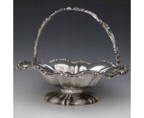 Victorian silver basket, the lobed bowl with a scrolled handle on spreading foor, Charles Lias, London 1838, diameter 31cm, 3
