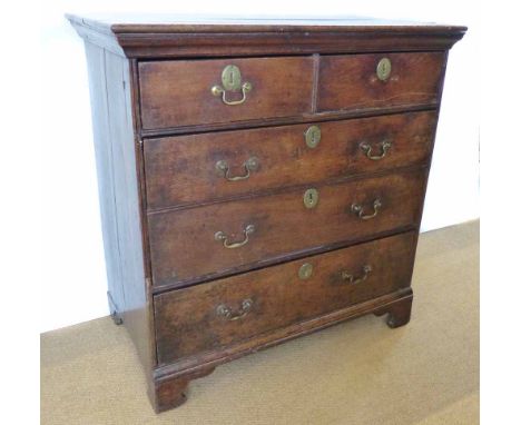 18th century oak chest of two short and three long graduated drawers with original brass bale handles, bracket feet, 97cm (38