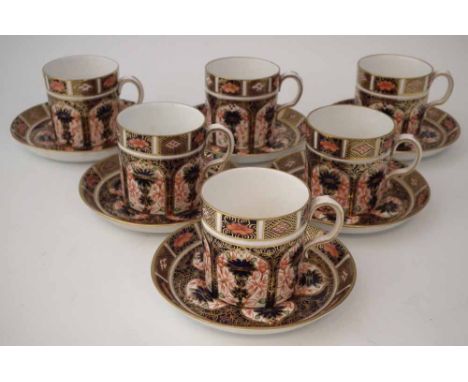 Six Royal Crown Derby coffee cups and saucers, decorated with imari 1128 pattern, date codes ranging around 1923 /26, (12)   