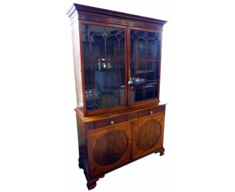 George III mahogany bookcase on cupboard, top section with Greek moulding to pediment, astragal glazed doors, original adjust