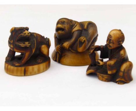 Japanese carved ivory netsuke depicting the Ryujin legend of a monkey on the back of a jellyfish fighting an octopus, Meiji p