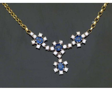 Sapphire and diamond necklace of four floral clusters on a 750 gold chain, gross weight 10.2g, each cluster 9.6mm. Condition 