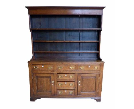 George III oak North Wales dresser, three shelf rack with pine boarded back above base, fitted six short drawers with diamond