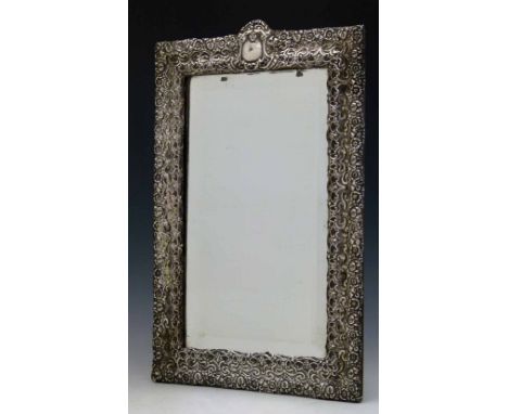 Silver mounted rectangular mirror (no hallmarks) with a bevelled plate, 37 x 24cm overall (originally with an easel stand).