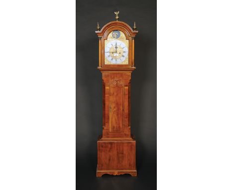 A 19th century eight day long case clock, the brass dial with a moon phase arch, silvered chapter ring, seconds dial and cale