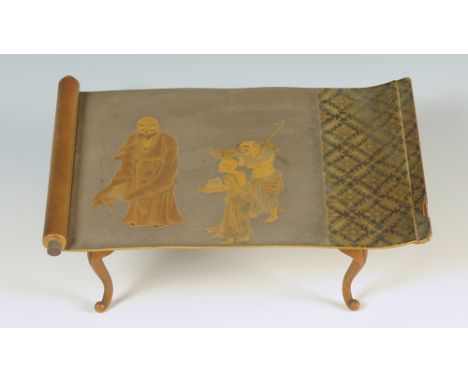 A Japanese nashiji lacquer hirashoku serving table on curving legs, the top modelled as a partly open kakemono showing a bear