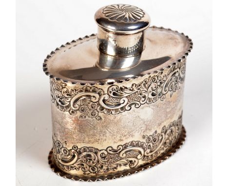 A Victorian silver tea caddy of oval form with two bands of embossed floral decoration and undulating rims, by Samuel Walton 