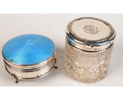 A circular silver dressing table compact with guilloche enamel lid, resting on three cabriole legs, Birmingham, Walker & Hall