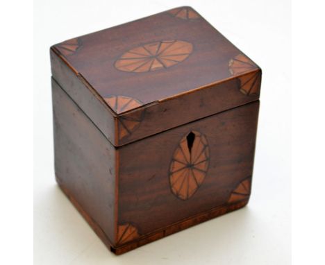 A small Georgian mahogany tea caddy with satin wood inlaid ovals and corners, height 12cm.
 Condition Report: The tea caddy i