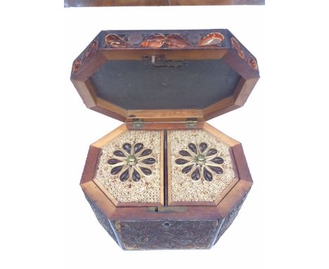 A rare dated scrolled paperwork tea caddy of octagonal section. The back with the date 1801 and indistinct initials M D. The 