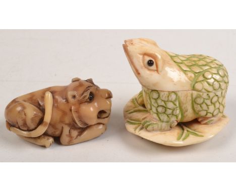A vegetable ivory netsuke, in the form of a crouching tiger, together with a bone box in the form of a frog.