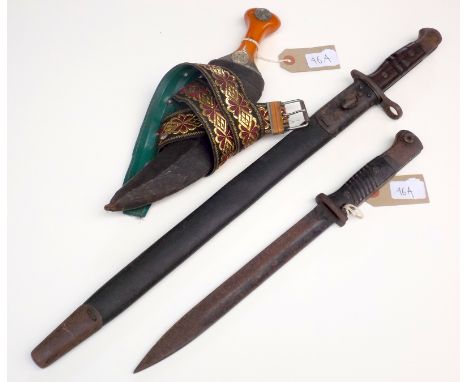 A Remington bayonet, dated 1913 in leather scabbard with a metal mount, together with a German WWI bayonet and a jambiya with