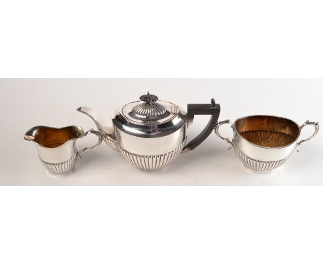 A half fluted three piece tea service.