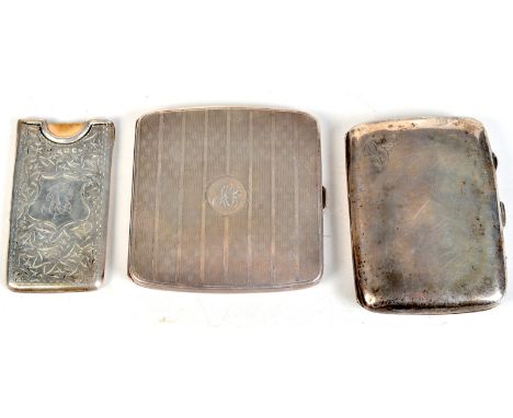 A silver card case belonging to Harold Praed, St Ives, engraved with ivy leaves around a central cartouche, contains card fro