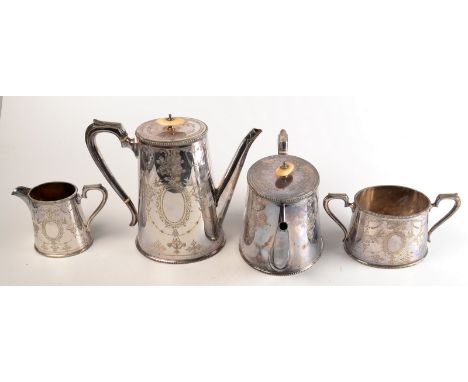 A Victorian four piece tea service engraved with flower baskets, birds and swags.