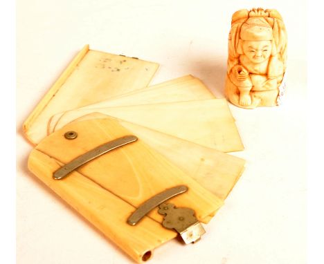 A bone carved netsuke, together with a 19th century European ivory aide memoire. 