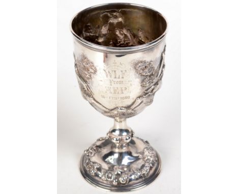 A Victorian silver otter hunting cup heavily inscribed and embossed, the stem knopped, the base decorated with flowers, Londo