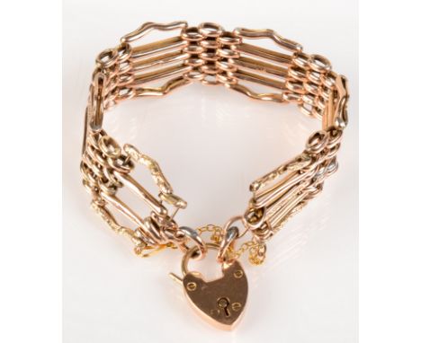 A 9ct fancy five bar gate link bracelet with padlock clasp. 14.4 gms.