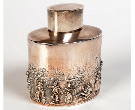 An oval Edwardian silver tea caddy in Dutch style, cast with peasants in a landscape, by Page, Keen & Page, Birmingham, 1905,