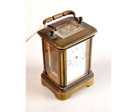 A small late 19th century French brass corniche cased carriage clock with cylinder escapement.  Height 7.5cm.