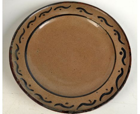 A rare early Bernard Leach plate, the rim with simple iron brushwork, painted B.L. monogram and impressed pottery mark.  Diam