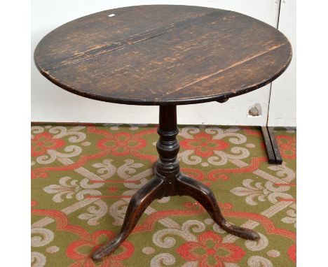 A Georgian oak tripod table.