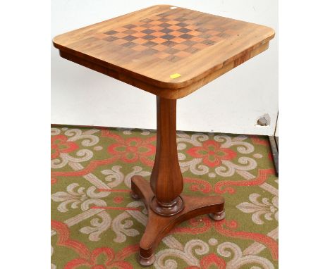 A Victorian mahogany  chess table with vase pedestal and tripod base.