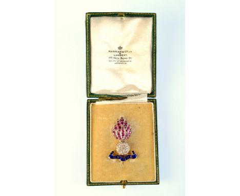A good gold and enamel Royal Engineers Ubique grenade brooch pave set with rubies and diamonds. Boxed. Condition Report: Size