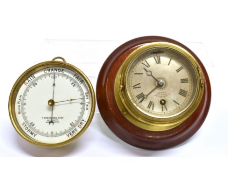 A SMALL BRASS CASED SHIPS BULKHEAD TYPE CLOCK  the silvered dial inscribed 'SEWILL LIVERPOOL Maker to the Royal Navy', 18.5cm