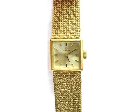 OMEGA, A LADY'S 9ct GOLD BRACELET WATCH, CIRCA 1966  the square brushed-silvered dial with raised gilt baton numerals and han