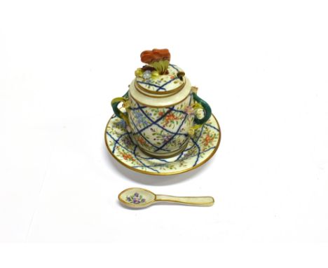 A CONTINENTAL CUP AND COVER ON SAUCER  with matching spoon, with floral decoration and butterfly finial to lid, twin branch h