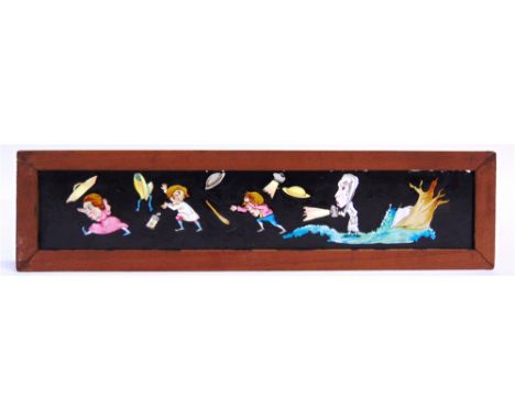 NINE HAND-PAINTED MAHOGANY-FRAMED MAGIC LANTERN STRIP SLIDES  the subjects including a steam train; loose bull; and a ghostly