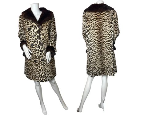 A vintage 1960s leopard fur coat with mink trim to the collar, cuffs and patch style pockets. Fully lined with a jacquard sat