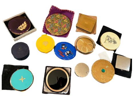 A collection of vintage compacts to include a large purple and gilt kigu compact with peach enamelled leaf, a gilt and turqoi