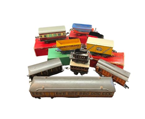 A collection of vintage Hornby O Gauge items to include a boxed side-tipping wagon, a Ffyfes banana van wagon, a boxed rotary